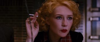 Movie still from “Black Book” (2006), directed by Paul Verhoeven – A person smoking a cigarette; Close Up shot, High angle