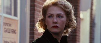 Movie still from “Black Book” (2006), directed by Paul Verhoeven – A beautiful woman with blonde hair and blue eyes; Close Up shot, Over the shoulder angle