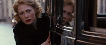 Movie still from “Black Book” (2006), directed by Paul Verhoeven – A woman looking at her reflection in a mirror; Close Up shot, Over the shoulder angle