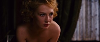 Movie still from “Black Book” (2006), directed by Paul Verhoeven – A beautiful woman with blonde hair and blue eyes looking at the camera; Close Up shot, High angle