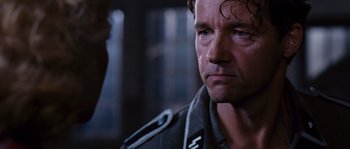 Movie still from “Black Book” (2006), directed by Paul Verhoeven – A person wearing a military uniform; Close Up shot, Over the shoulder angle