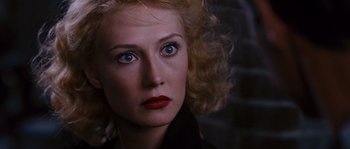 Movie still from “Black Book” (2006), directed by Paul Verhoeven – A person with blue eyes; Close Up shot, Over the shoulder angle