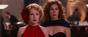 Movie still from “Black Book” (2006), directed by Paul Verhoeven – Two women are standing next to each other; Close Up shot, Over the shoulder angle