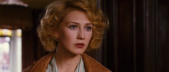 Movie still from “Black Book” (2006), directed by Paul Verhoeven – A person with curly hair; Close Up shot, Over the shoulder angle