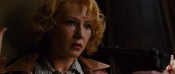 Movie still from “Black Book” (2006), directed by Paul Verhoeven – A person with blonde curly hair; Close Up shot, Low angle