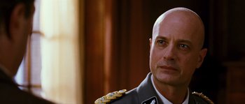 Movie still from “Black Book” (2006), directed by Paul Verhoeven – A person wearing a military uniform; Close Up shot, Low angle