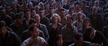 Movie still from “Black Book” (2006), directed by Paul Verhoeven – A group of people standing in a room; Wide shot, High angle