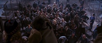 Movie still from “Black Book” (2006), directed by Paul Verhoeven – A group of people sitting in a room; Wide shot, High angle