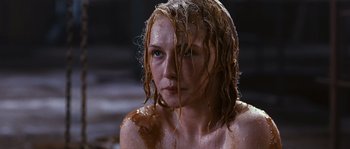 Movie still from “Black Book” (2006), directed by Paul Verhoeven – A woman with wet hair and blue eyes sitting in a bath tub; Close Up shot, High angle