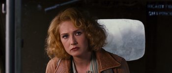 Movie still from “Black Book” (2006), directed by Paul Verhoeven – A person with curly hair; Close Up shot, Over the shoulder angle