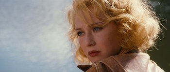 Movie still from “Black Book” (2006), directed by Paul Verhoeven – A person with blonde curly hair; Close Up shot, Low angle
