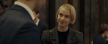 Movie still from “Black Box” (2021), directed by Yann Gozlan – A woman with short blonde hair wearing a black jacket; Close Up shot, Over the shoulder angle