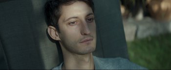 Movie still from “Black Box” (2021), directed by Yann Gozlan – A man's face in a car; Close Up shot, High angle