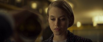 Movie still from “Black Box” (2021), directed by Yann Gozlan – A young woman is looking down at her face; Close Up shot, Low angle