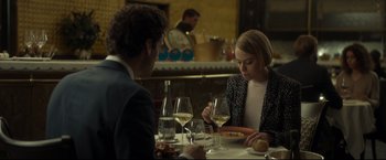 Movie still from “Black Box” (2021), directed by Yann Gozlan – A man and a woman sitting at a table with wine glasses; Medium shot, Over the shoulder angle