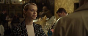 Movie still from “Black Box” (2021), directed by Yann Gozlan – A woman in a black and white polka dot jacket; Close Up shot, Over the shoulder angle