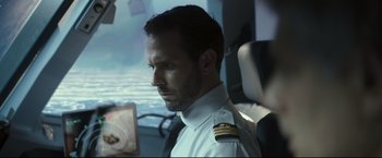 Movie still from “Black Box” (2021), directed by Yann Gozlan – A person wearing a uniform; Close Up shot, Low angle