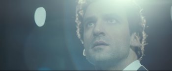 Movie still from “Black Box” (2021), directed by Yann Gozlan – A person looking up at the sky; Close Up shot, Low angle