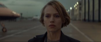 Movie still from “Black Box” (2021), directed by Yann Gozlan – A person with short hair; Close Up shot, Low angle