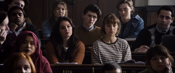 Movie still from “Black Christmas” (2019), directed by Sophia Takal – A group of young people sitting in a room; Medium shot, High angle