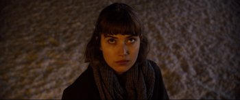 Movie still from “Black Christmas” (2019), directed by Sophia Takal – A person wearing a scarf; Close Up shot, High angle