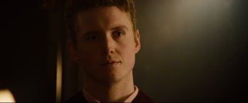 Movie still from “Black Christmas” (2019), directed by Sophia Takal – A person wearing a sweater; Close Up shot, Over the shoulder angle