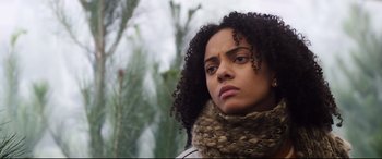 Movie still from “Black Christmas” (2019), directed by Sophia Takal – A person wearing a scarf and jacket; Close Up shot, Low angle