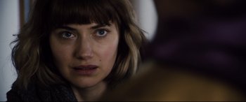 Movie still from “Black Christmas” (2019), directed by Sophia Takal – A woman's eyes and face; Close Up shot, Over the shoulder angle