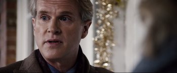 Movie still from “Black Christmas” (2019), directed by Sophia Takal – A person wearing a jacket; Close Up shot, Over the shoulder angle