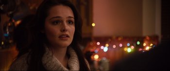 Movie still from “Black Christmas” (2019), directed by Sophia Takal – A person with long hair; Close Up shot, Over the shoulder angle
