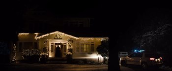 Movie still from “Black Christmas” (2019), directed by Sophia Takal – A house with a lot of christmas lights on it; Extreme Wide shot, Low angle