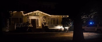 Movie still from “Black Christmas” (2019), directed by Sophia Takal – A house with a lot of christmas lights on it; Extreme Wide shot, High angle