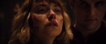 Movie still from “Black Christmas” (2019), directed by Sophia Takal – A person with makeup on their face; Close Up shot, Low angle