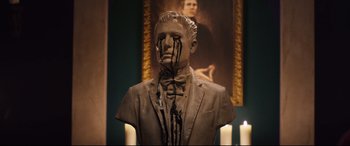 Movie still from “Black Christmas” (2019), directed by Sophia Takal – A statue of a man with blood on it's face; Close Up shot, Low angle