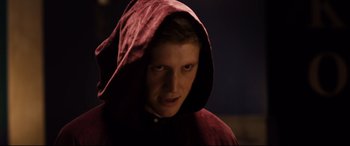 Movie still from “Black Christmas” (2019), directed by Sophia Takal – A young man wearing a red hooded sweatshirt; Close Up shot, Low angle