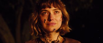 Movie still from “Black Christmas” (2019), directed by Sophia Takal – A person with a face tattoo; Close Up shot, High angle