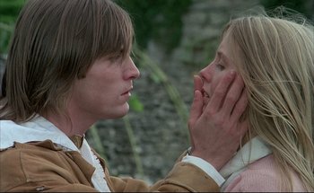 Movie still from “Black Moon” (1975), directed by Louis Malle – A man and a woman touching each other's face; Close Up shot, Low angle