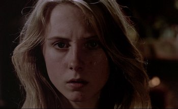 Movie still from “Black Moon” (1975), directed by Louis Malle – A person with long hair; Close Up shot, Low angle
