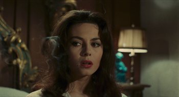 Movie still from “Black Sabbath” (1963), directed by Mario Bava – A person smoking a cigarette in a room; Close Up shot, High angle