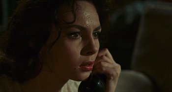 Movie still from “Black Sabbath” (1963), directed by Mario Bava – A woman is talking on the phone and looking at the camera; Close Up shot, High angle