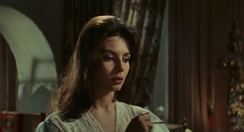 Movie still from “Black Sabbath” (1963), directed by Mario Bava – A beautiful woman holding a cigarette in her mouth; Close Up shot, High angle
