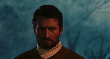 Movie still from “Black Sabbath” (1963), directed by Mario Bava – A person wearing a neck scarf; Close Up shot, Low angle