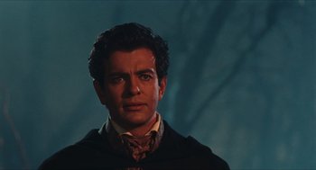 Movie still from “Black Sabbath” (1963), directed by Mario Bava – A person wearing a suit and tie; Close Up shot, Over the shoulder angle