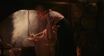 Movie still from “Black Sabbath” (1963), directed by Mario Bava – A woman is cooking something in a pot; Medium shot, Low angle