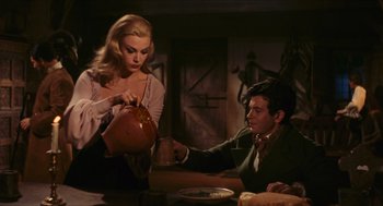 Movie still from “Black Sabbath” (1963), directed by Mario Bava – A man and a woman are drinking tea together; Medium shot, Over the shoulder angle