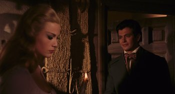 Movie still from “Black Sabbath” (1963), directed by Mario Bava – A man and a woman standing next to each other; Medium shot, Over the shoulder angle