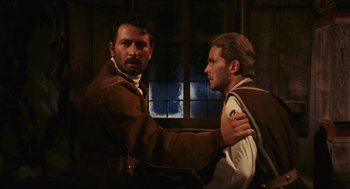 Movie still from “Black Sabbath” (1963), directed by Mario Bava – Two men are standing in front of a window; Medium shot, Over the shoulder angle