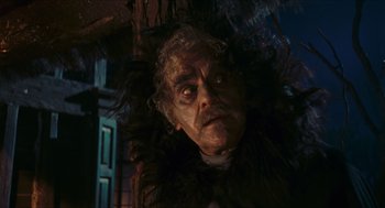 Movie still from “Black Sabbath” (1963), directed by Mario Bava – A person wearing a costume; Close Up shot, Low angle