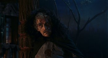 Movie still from “Black Sabbath” (1963), directed by Mario Bava – A man with a beard and long hair is laying on the ground; Medium shot, Low angle