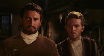 Movie still from “Black Sabbath” (1963), directed by Mario Bava – Two men standing next to each other in front of a wall; Close Up shot, Low angle